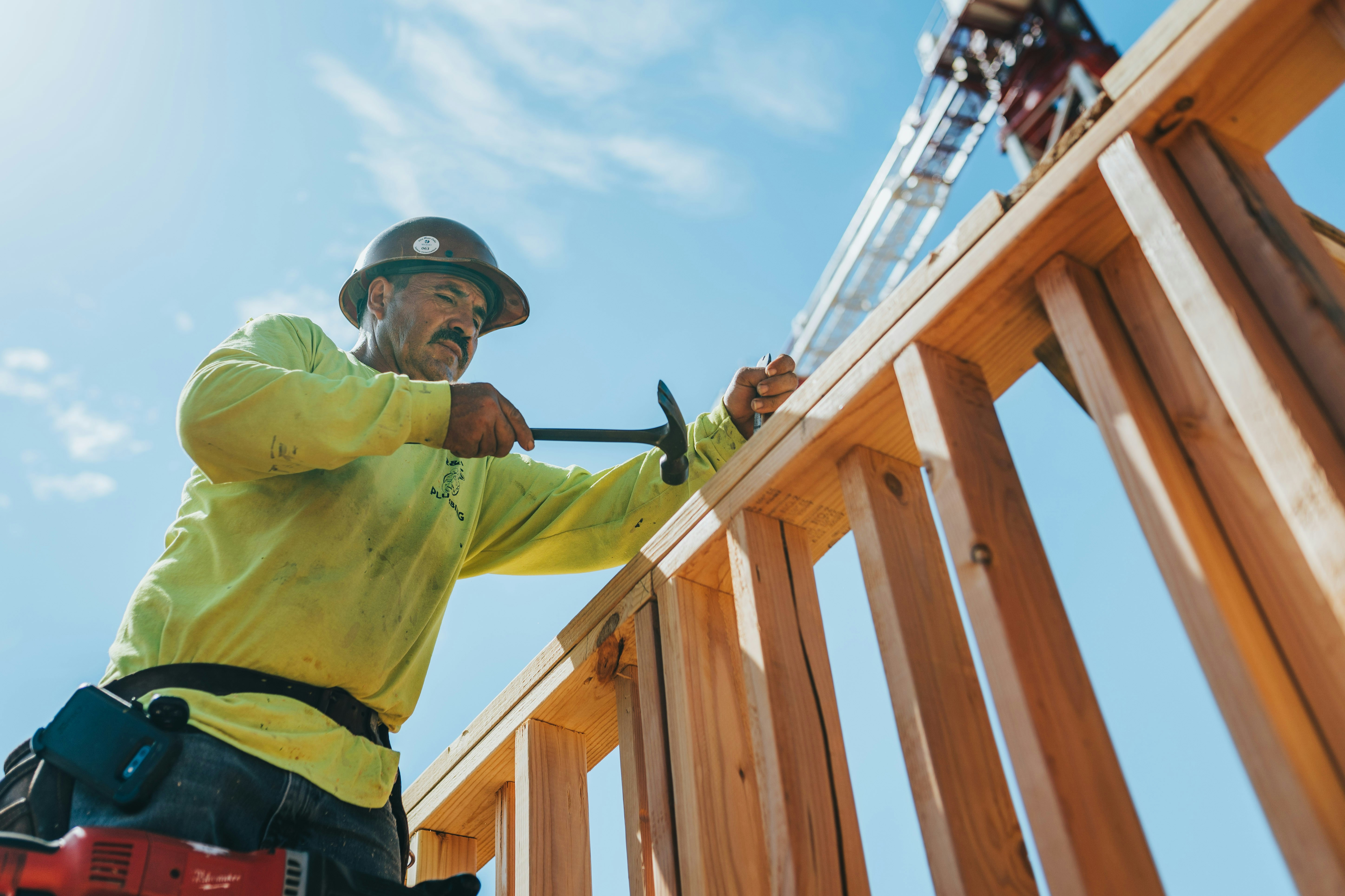 Construction worker cutting stone